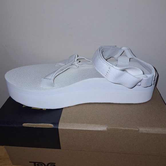 A pair of Teva W. Flatform Universal sandals in solid white in a ladies Size 9. - Picture 7 of 10